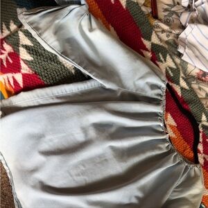 Top half sleeve blue. Has a small stain. It can on over the shoulders